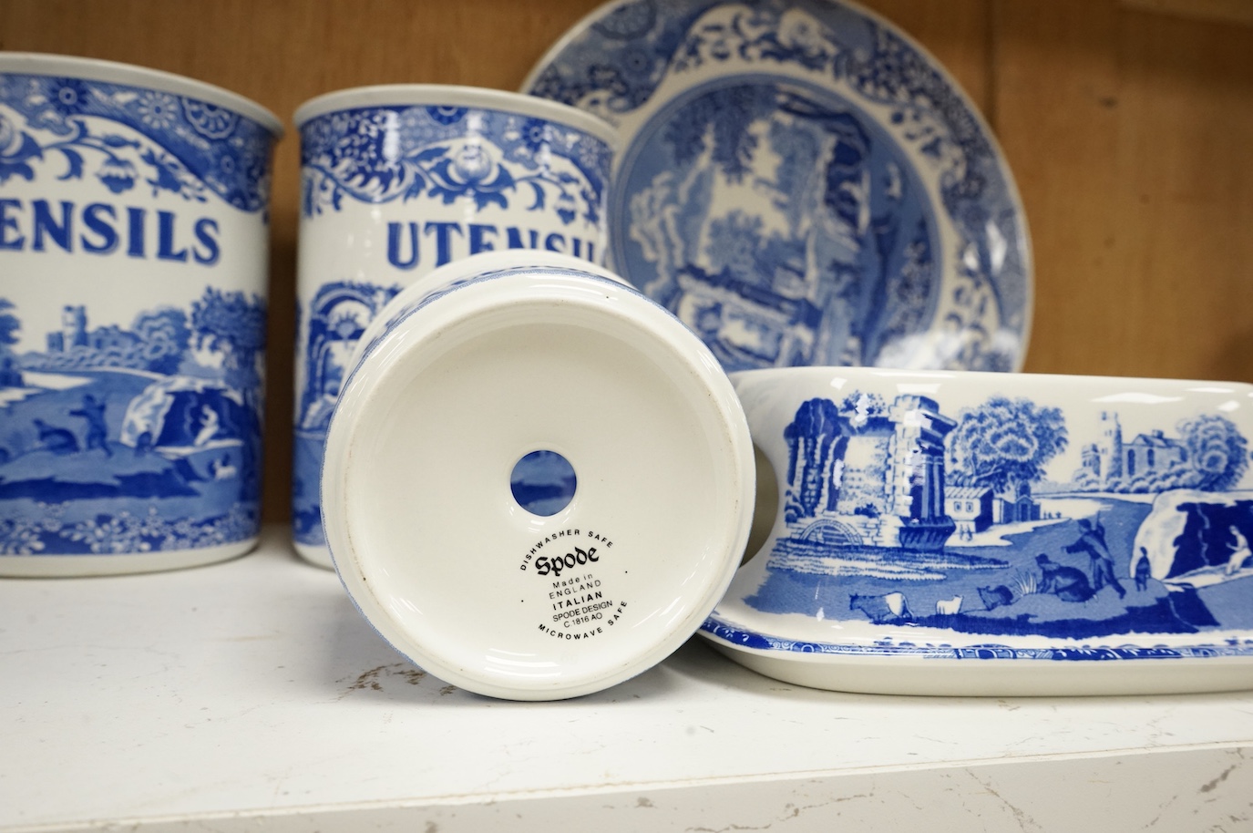 A collection of Spode Italian kitchenwares including utensil jars, bread board etc. (13). Bread plate 29cm diameter.
